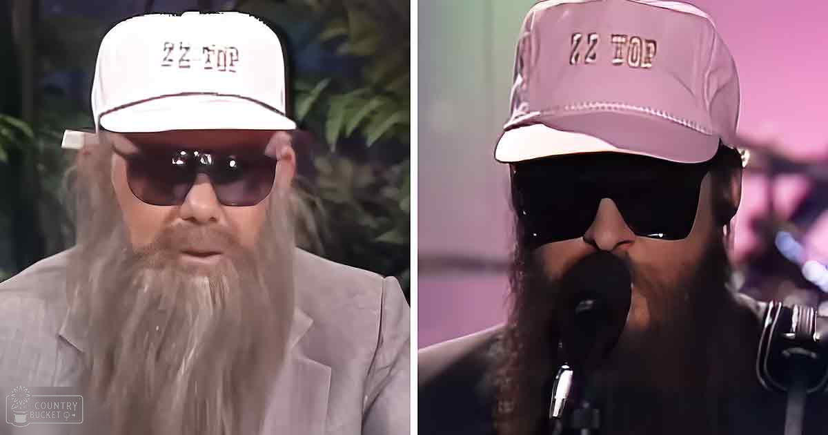 A middle-aged man with long hair and beard, wearing a cap labeled 'ZZ TOP,' stands at an event or performance setting.
