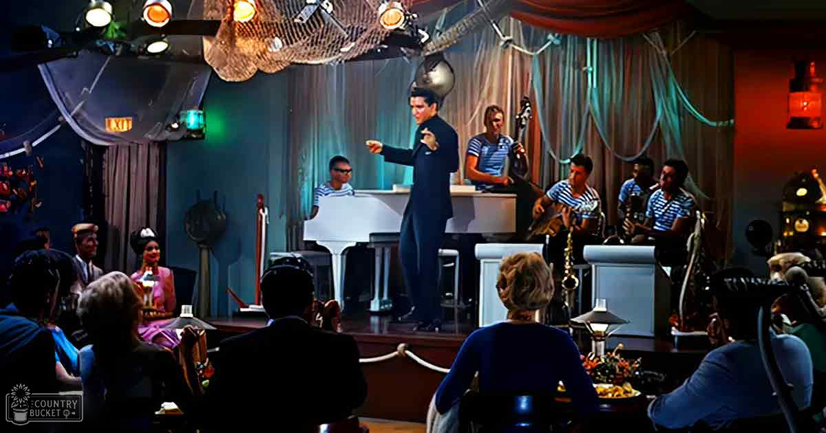 A lively jazz performance in an intimate indoor venue with a nautical theme, with stage performers and an audience seated at tables.