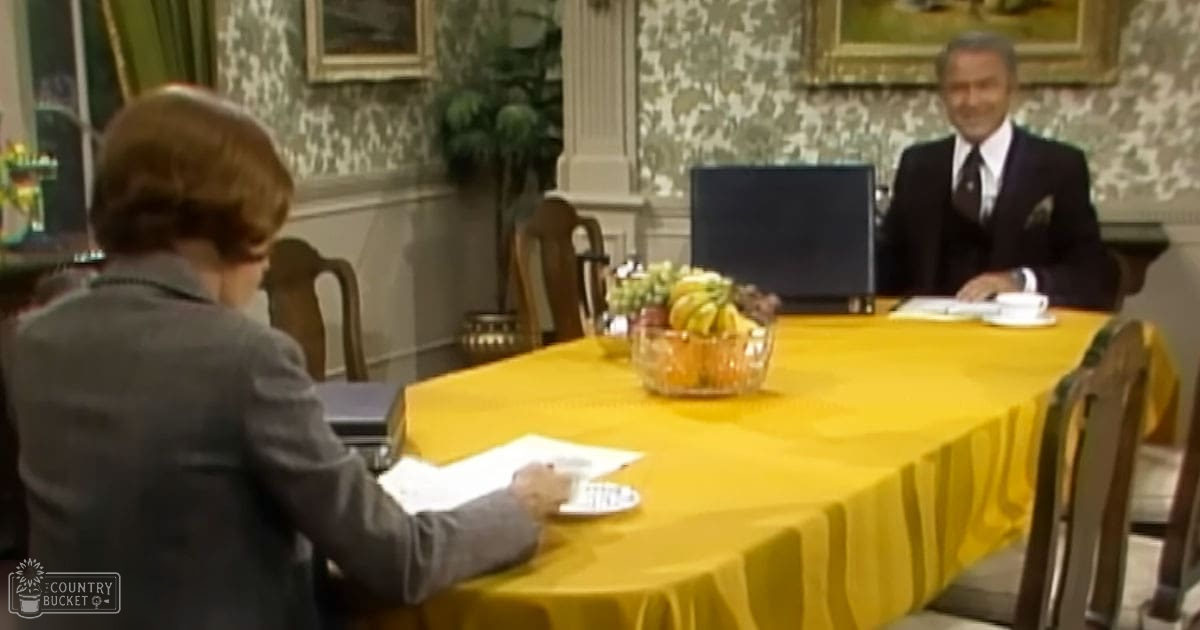 A talk show set with a host and guest in a studio environment.