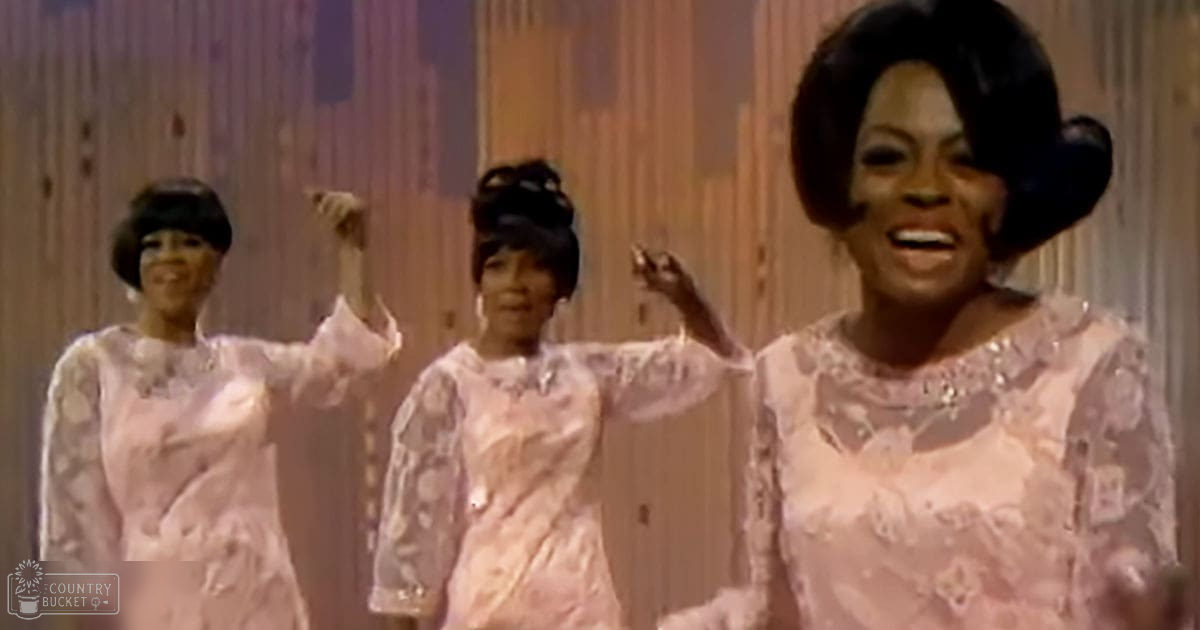 A group performance scene indoors with wooden paneling in the background.