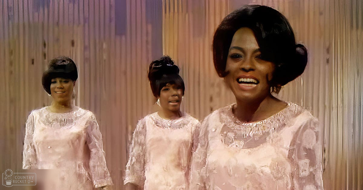 Three women performing in an indoor studio setting with a simple wooden backdrop and even artificial lighting.