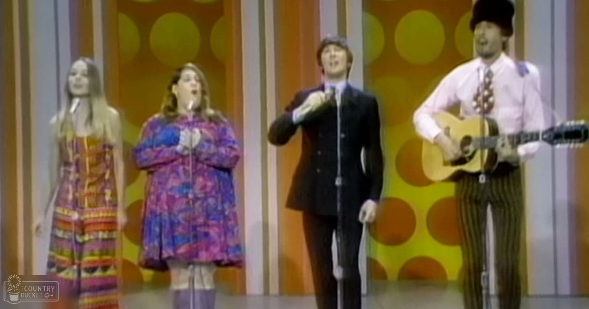 Adult females in a studio setting with colorful striped and abstract patterned garments; adult males in formal attire, suggesting a music or performance context.