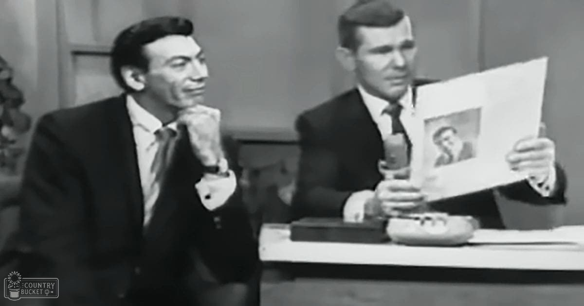 Adult males in a mid-20th-century studio setting, dressed formally with dark suits; minimal decor suggests a simple talk show environment.