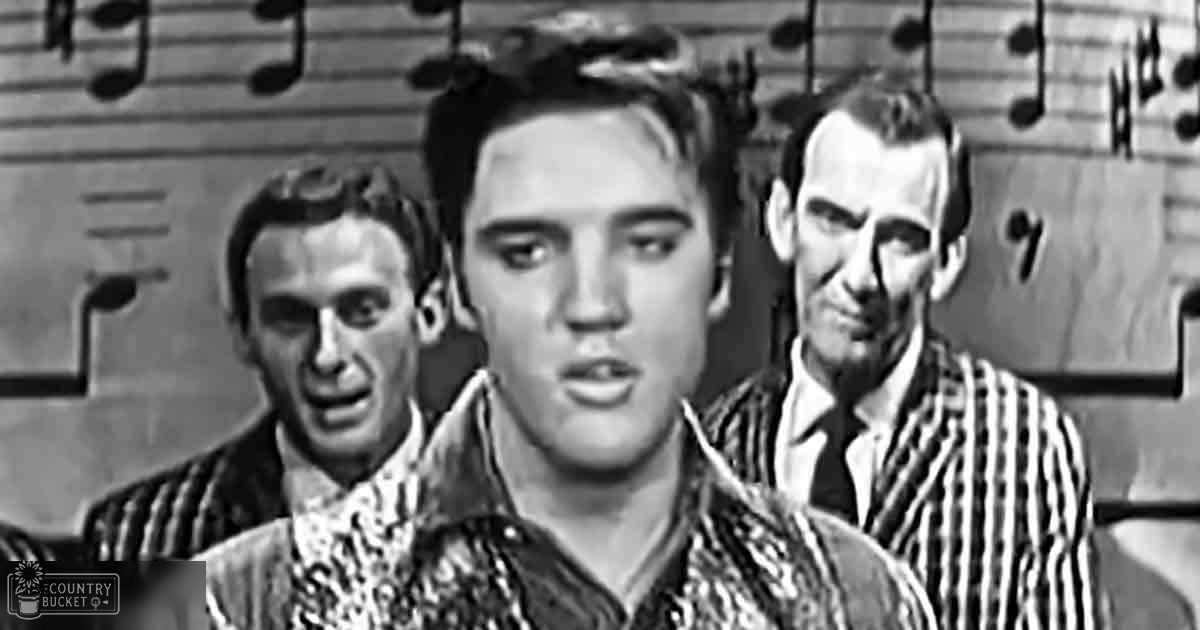 Young adult male in patterned shirt indoors, middle-aged male in pinstriped suit jacket, musical notes backdrop suggesting performance or recording studio setting with artificial lighting and monochromatic colors.