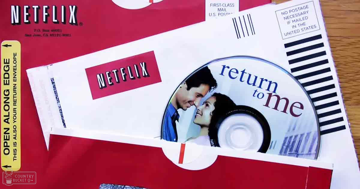 A Netflix DVD envelope with a 'Return to Me' disc inside, placed indoors.