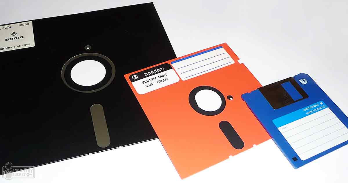 Indoor scene with three vintage floppy disks on a plain surface; labels indicate 'Floppy Disk 5,25 HD,DS.'
