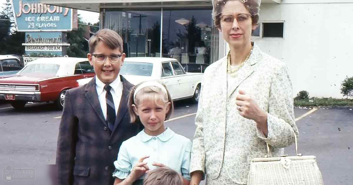 A vintage diner scene with a woman in glasses wearing a patterned jacket outside an establishment advertising 'Johnson's Ice Cream 29 Flavors' and classic cars parked in a mid-20th century outdoor parking lot, suggesting spring or summer season.