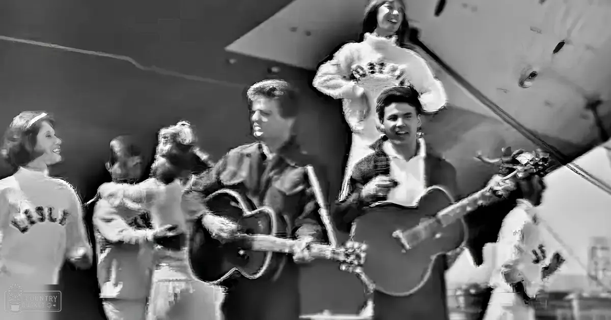 Musical performance in an urban setting with a large aircraft wing backdrop, black and white aesthetic suggesting mid-20th century style.