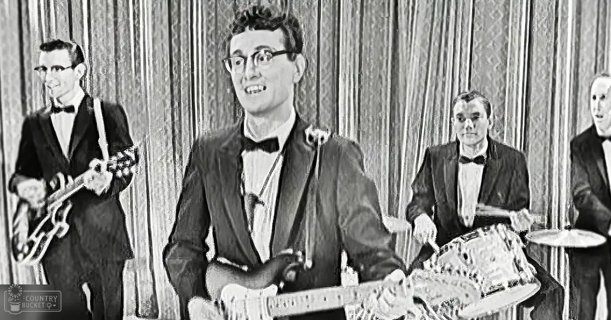 Young adult male musicians performing on an indoor stage with curtains in the background.