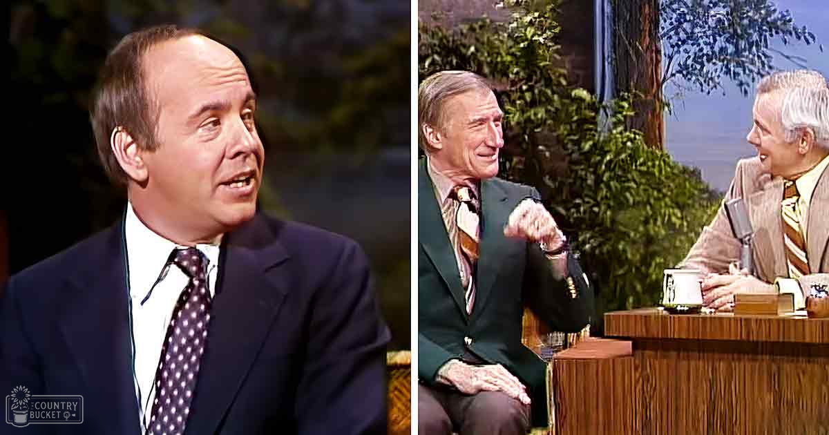 Three adult males wearing formal suits and ties seated during what appears to be an interview or talk show setup. Greenery in the background suggests a daytime outdoor studio environment.