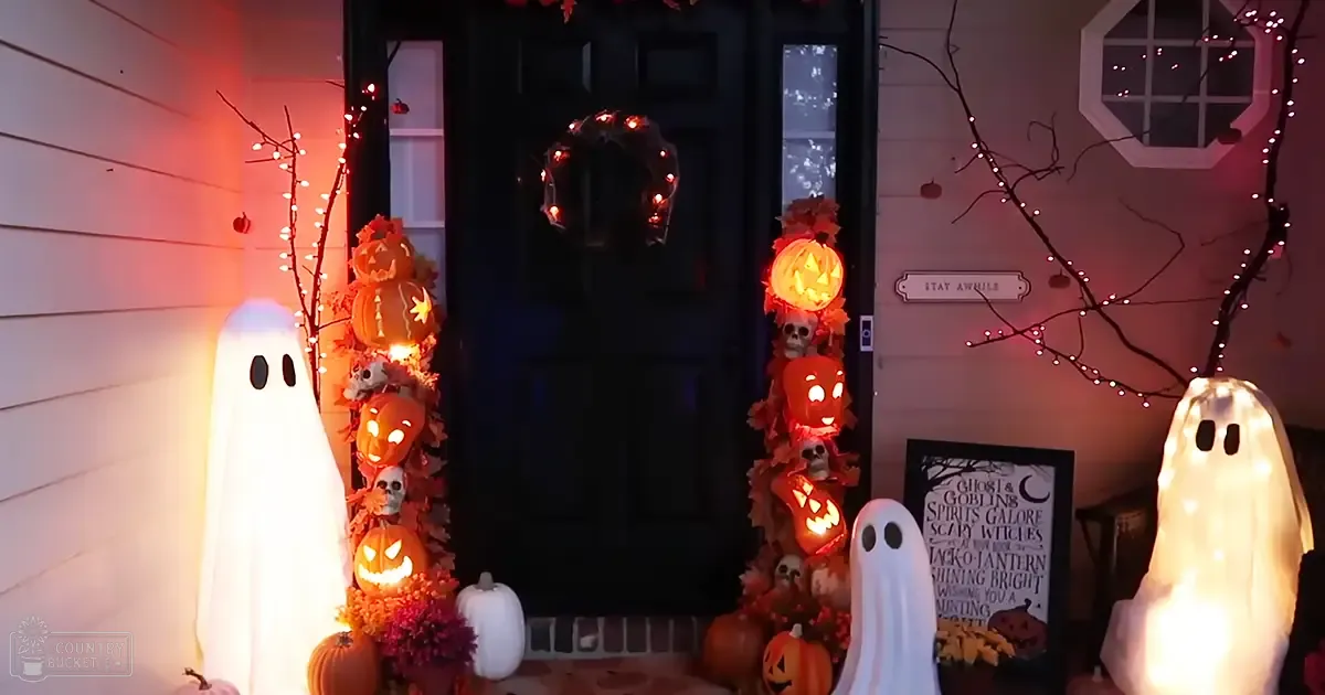 Halloween-themed porch scene with glowing ghostly figures, Jack-o'-lanterns, pumpkins, and festive decorations in a residential area during autumn evening.