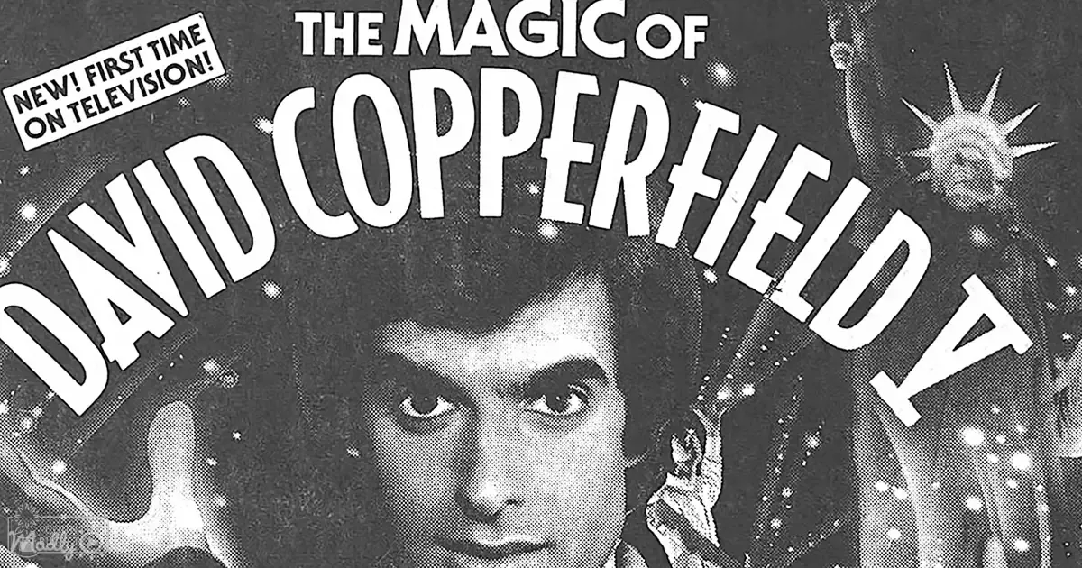 David Copperfield in a promotional image for his magic show, wearing a dark hat with an ornate detail resembling a crown against a night sky backdrop.