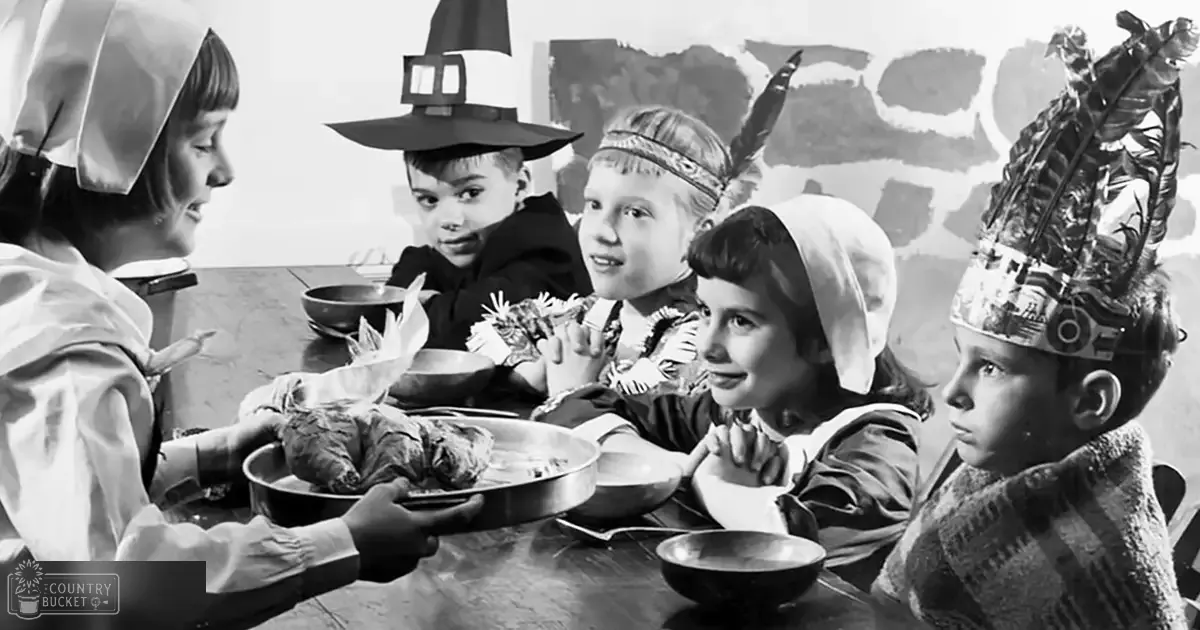 A group of children dressed in historical costumes indoors, possibly during a reenactment or themed event.