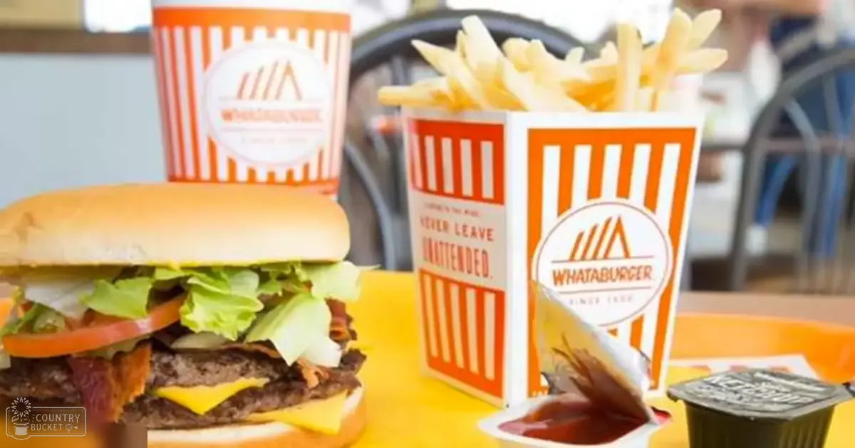 A Whataburger meal with fries in an indoor restaurant setting.