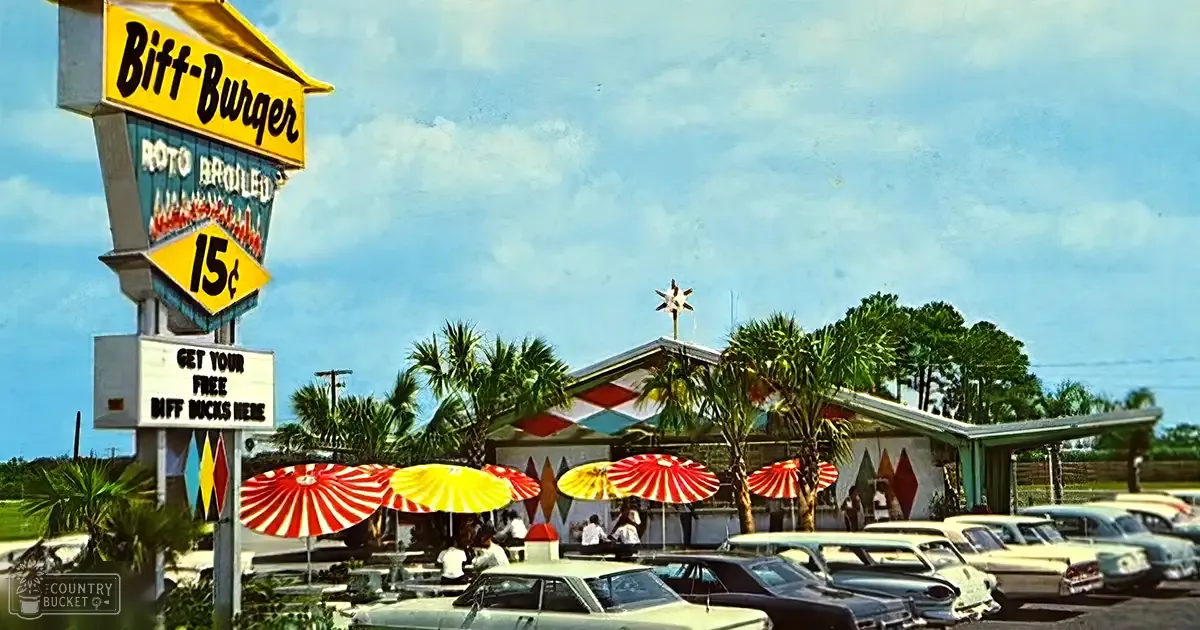 A retro-style diner called 'Biff-Burger' with several adults wearing casual attire under umbrellas; vintage cars parked in front; vibrant signboard advertising 'Biff-Burger' and a special offer.