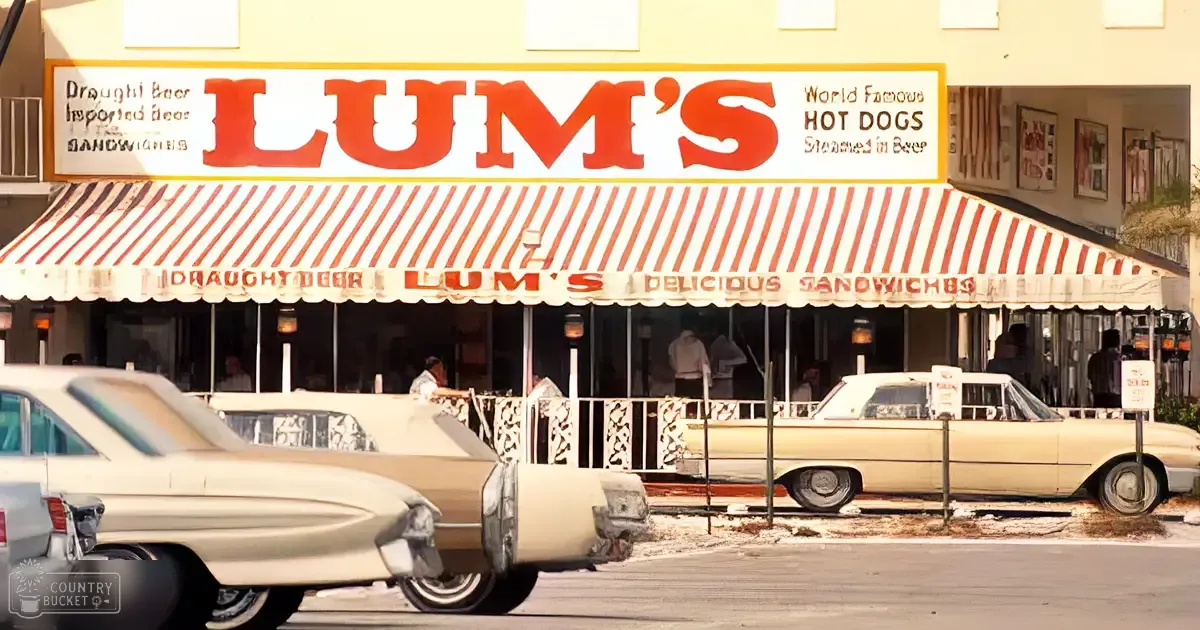 Vintage cars parked outside Lum's restaurant, a sunny day with clear skies and bright lighting in spring or summer.