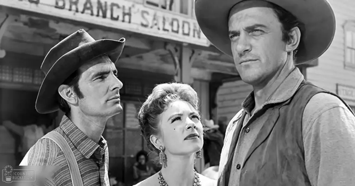 A bustling late 19th or early 20th-century Western scene with wooden architecture and muted tones, set in front of the Branch Saloon.