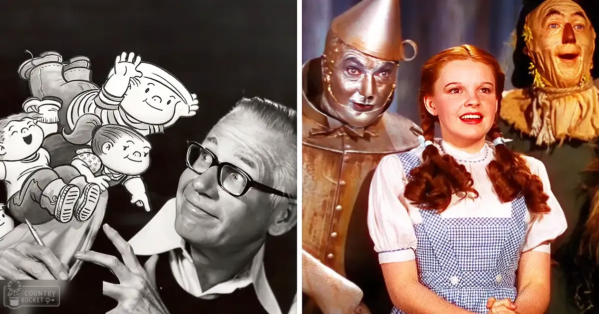 A scene from 'The Wizard of Oz' with characters including an older male figure, children, Dorothy, and inanimate objects like the Tin Man and Scarecrow against a dark studio backdrop.