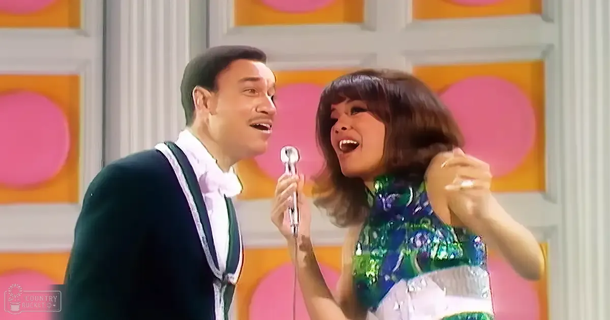 A mid-20th century musical performance scene with vibrant, colorful decorations in the background.