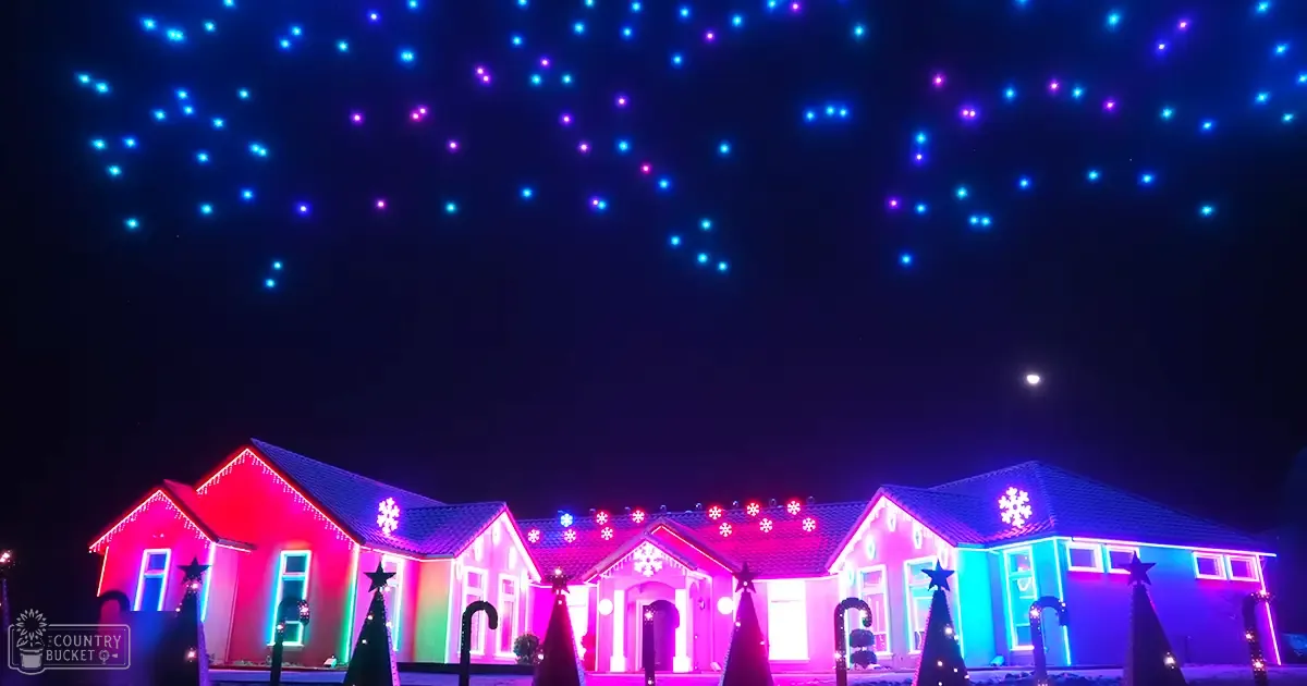 A residential house adorned with colorful holiday lights during Christmas season at nighttime.