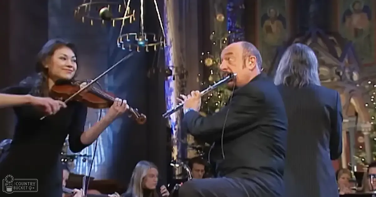 A festive indoor performance with musical instruments and Christmas decorations.