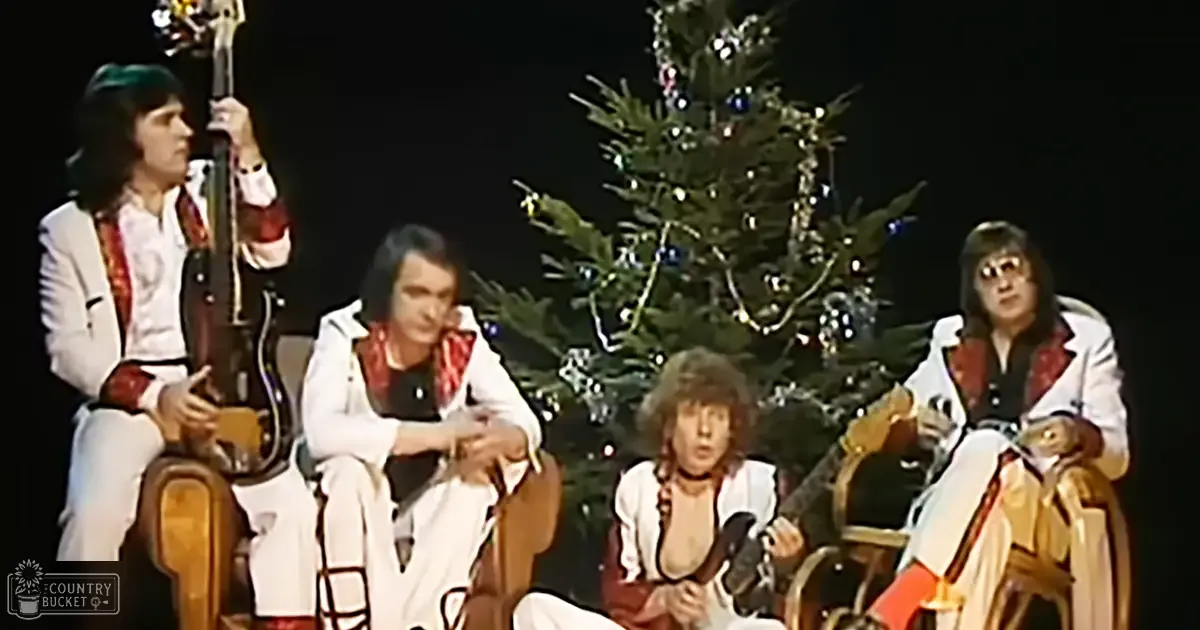 Musical performance in front of a decorated Christmas tree during the holiday season.