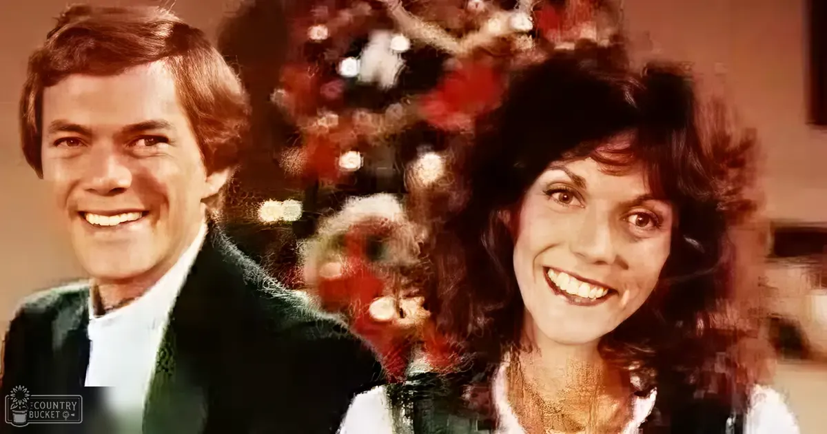 A couple standing in front of a decorated Christmas tree indoors during the holiday season.