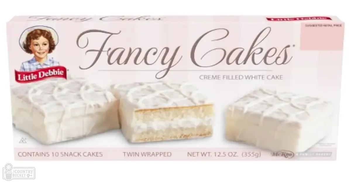 Close-up of Little Debbie Fancy Cakes packaging in a retail setting.
