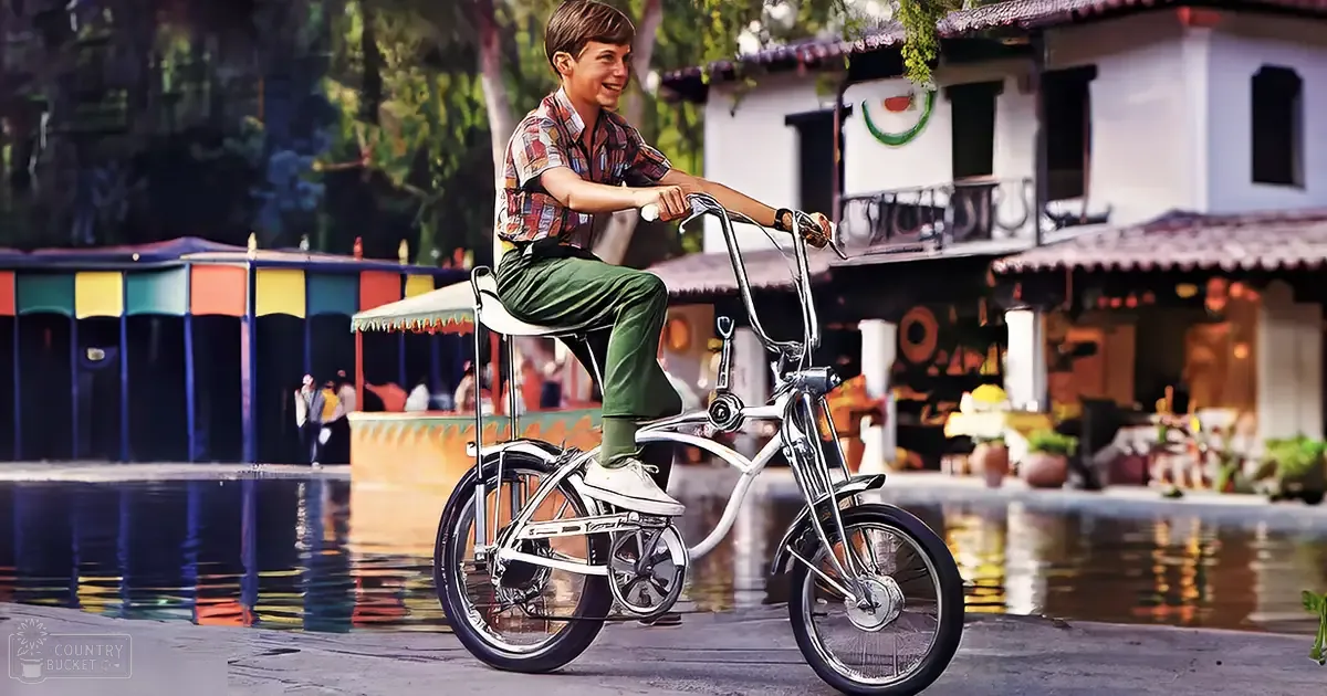 A child wearing a plaid shirt, green pants, white socks, and sneakers rides a bicycle in a vibrant outdoor setting with colorful buildings and festive decorations.