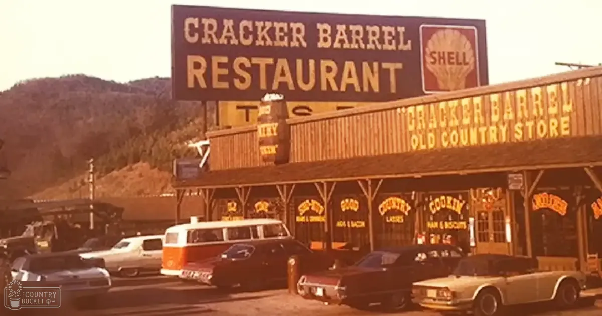 Cracker Barrel Restaurant old-fashioned rural setting with vehicles and country store items in warm daylight tones