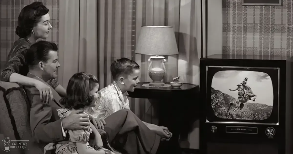 A family of four in a living room with a vintage television set and decorative items.