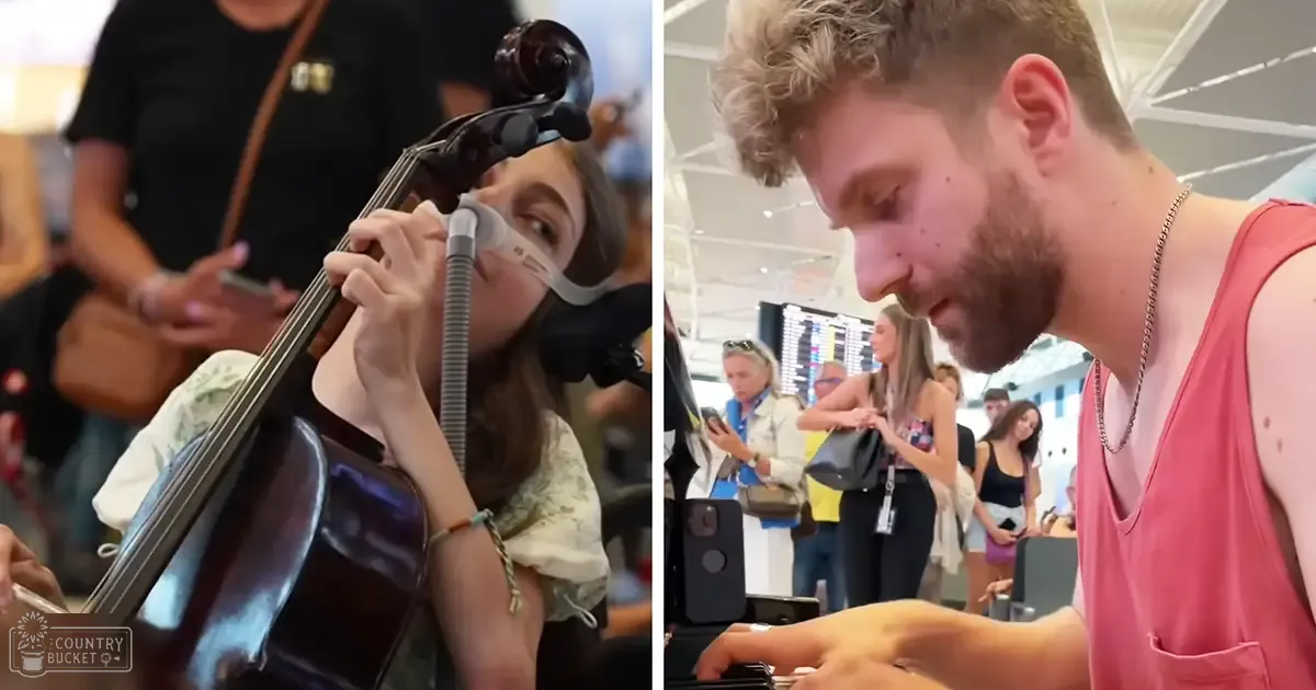 A young adult female plays a cello in an indoor public space filled with people carrying luggage, possibly during travel time.
