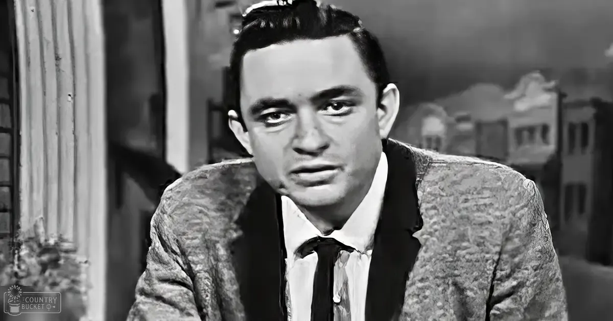 Young adult male wearing textured blazer and white collared shirt with dark tie, mid-20th-century style, urban setting with old weathered buildings, spring or fall attire, even natural light.