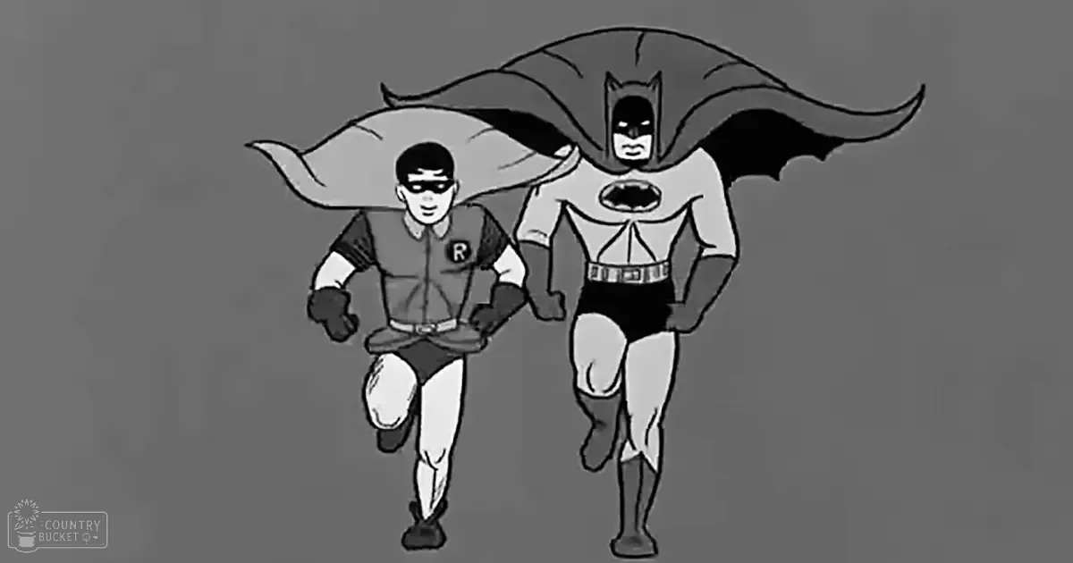 Batman and Robin running together in an animated series against a plain gray background.