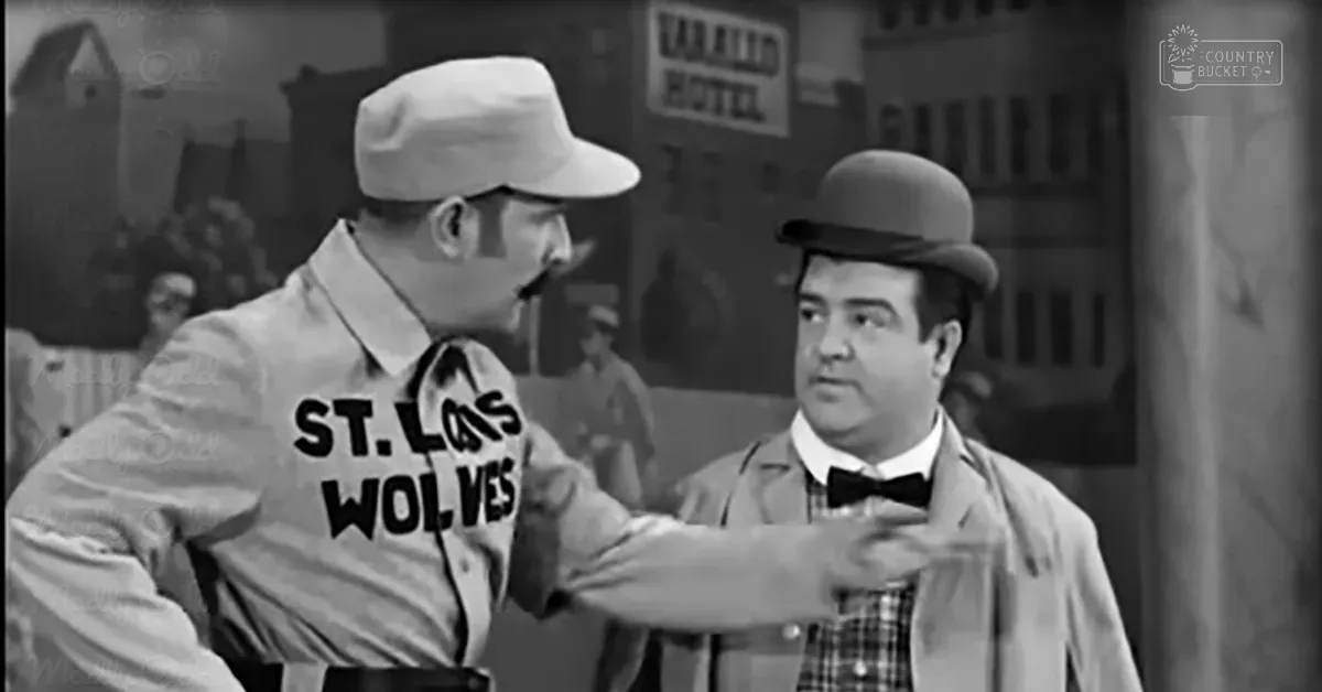 Two men stand on an urban street with a 'Valleo Hotel' sign visible in the background, suggesting a mid-20th-century setting.