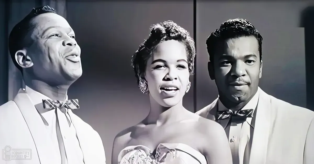 A mid-20th century musical performance scene with adults in formal attire on a stage with dark backdrop and artificial lighting.