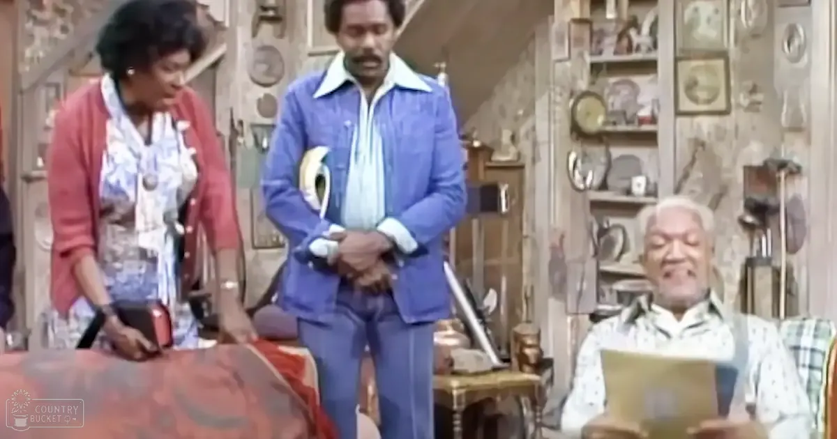 Three adults in a shop setting, one seated reading with two others standing nearby; red cardigan, blue striped blazer, patterned blouse, and yellow paper suggest an antique shop from the 1970s or early 1980s.