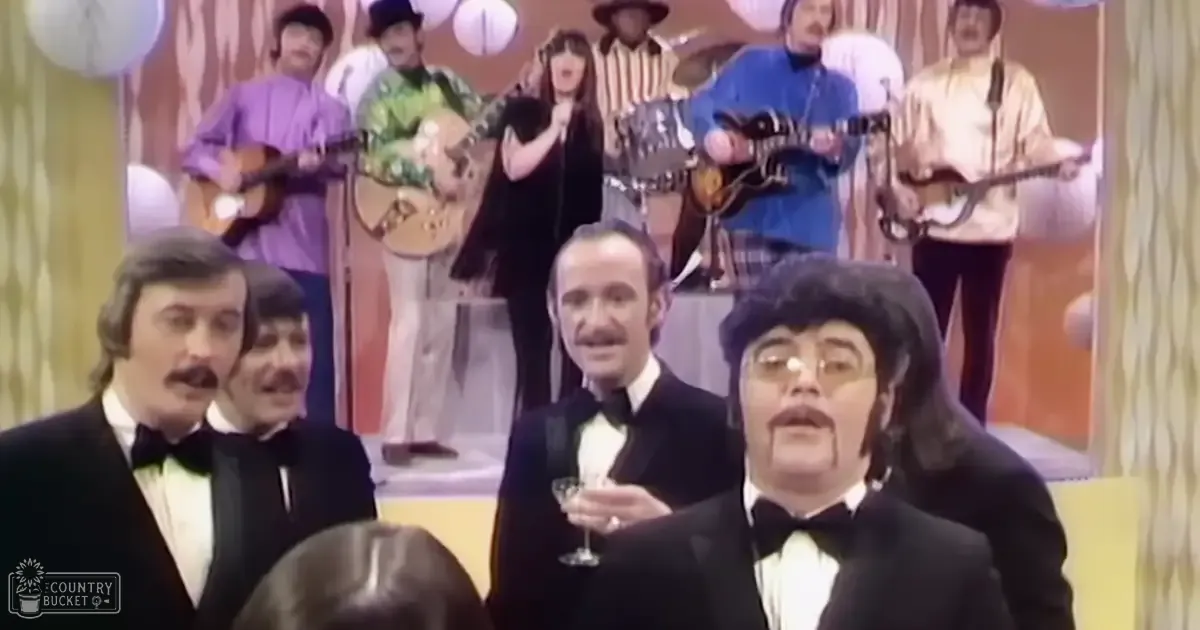 A vibrant stage performance scene from the 1970s with young adults in formal attire holding a small glass of champagne amidst musicians and performers on a brightly lit stage.