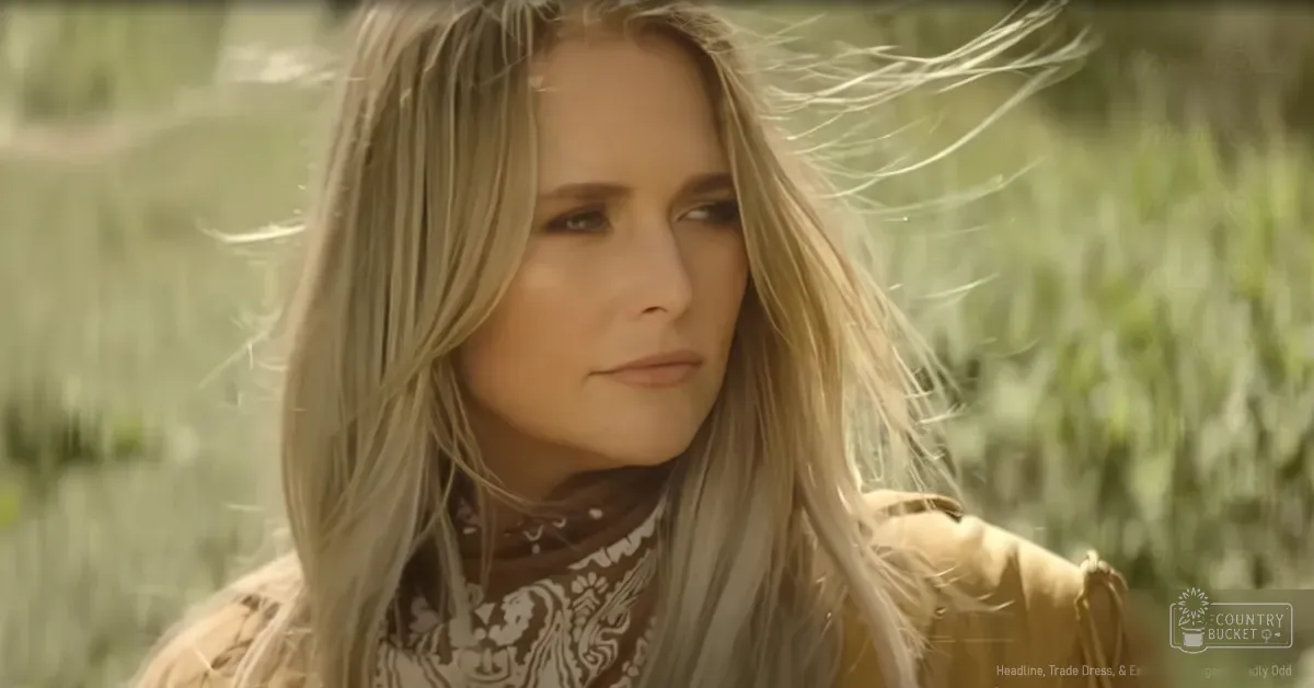 A young adult female wearing a patterned scarf stands outdoors in a grassy setting, suggesting spring or summer.