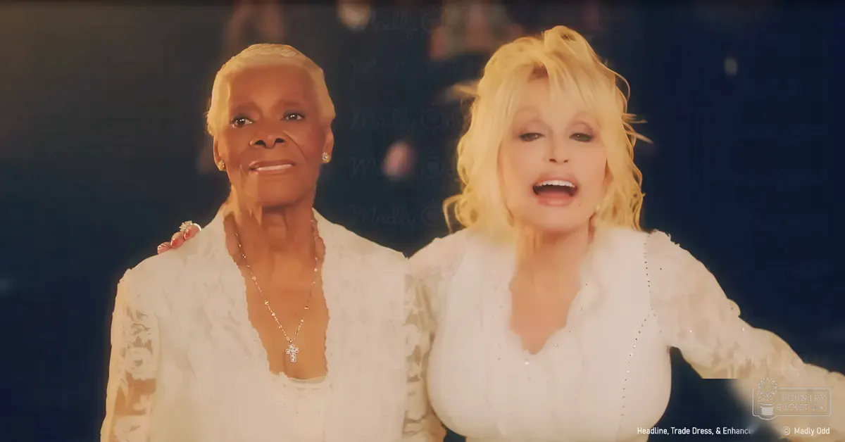 Two women in a studio setting, one wearing a white lace blouse with ruffled sleeves and a silver necklace, the other in a similar blouse with decorative embellishments.