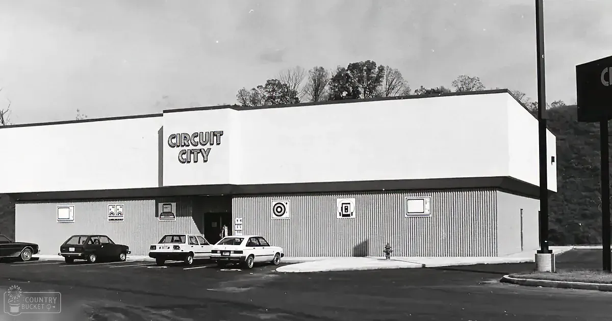 A Circuit City store with a simple facade and parked cars in front.