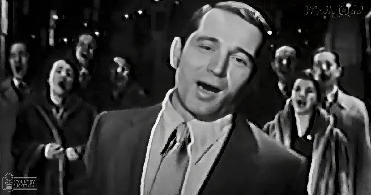 Indoor scene with formally dressed adults and children singing or speaking in an older-style building, possibly during daytime.